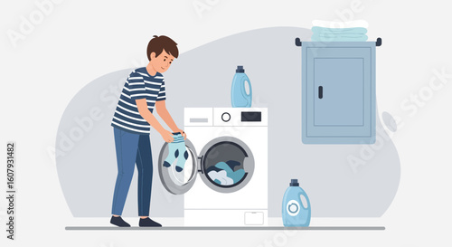 Young Man Loading Washing Machine With Laundry For Domestic Hygiene