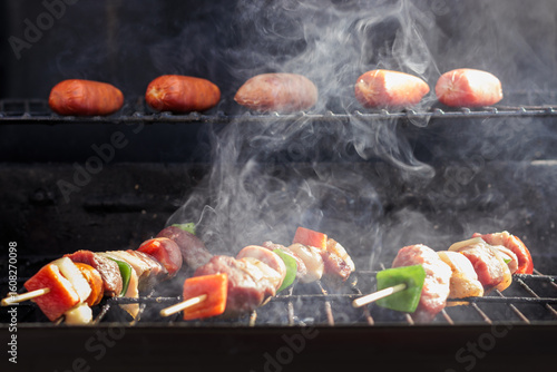 Chilean Independence Day: anticuchos and longanizas cooking on smoky grill