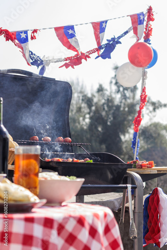 Chilean Independence Day: vertical view of barbecue and decorations with anticuchos and longanizas