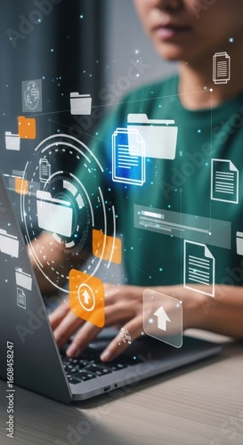 Futuristic digital workspace with holographic interface. Person using laptop with floating tech icons. Modern virtual office with dynamic UI elements.