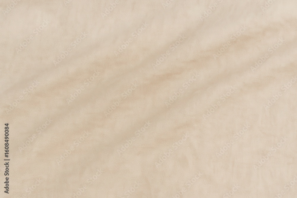 Beige crumpled cotton fabric background with soft light Beige crumpled cotton fabric background with soft light