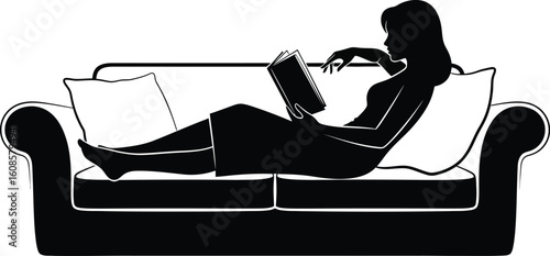A woman is relaxing on a couch while reading a book