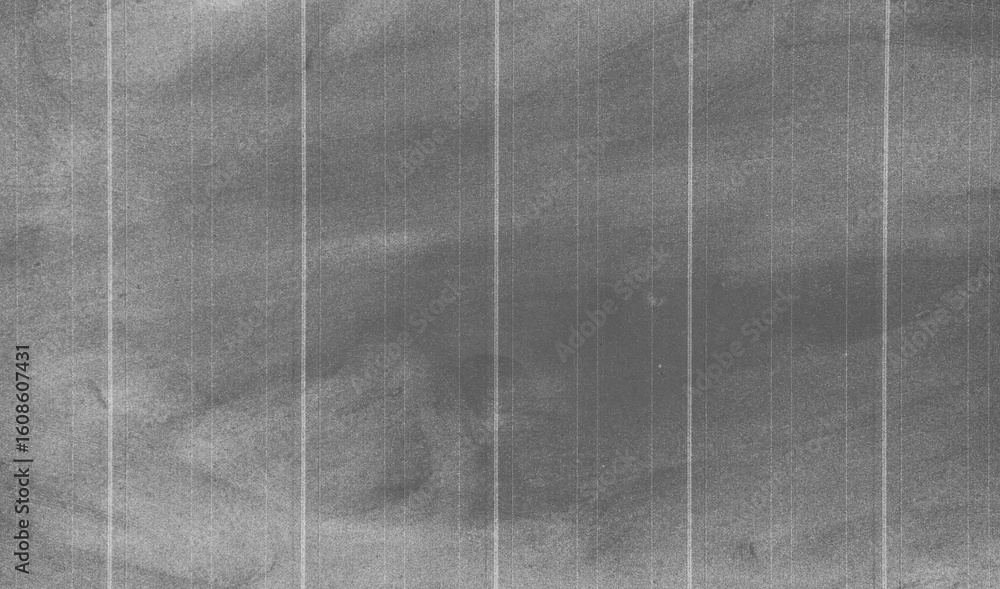 Fototapeta premium Crumpled black paper texture . Abstract dark background with fold lines