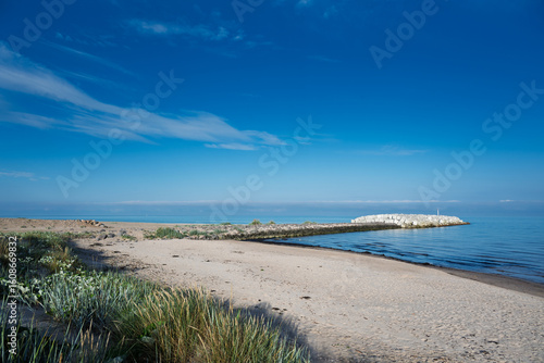 Fototapeta Naklejka Na Ścianę i Meble -  Hydraulic structure groyne in Baltic sea next to Liepaja, Latvia.