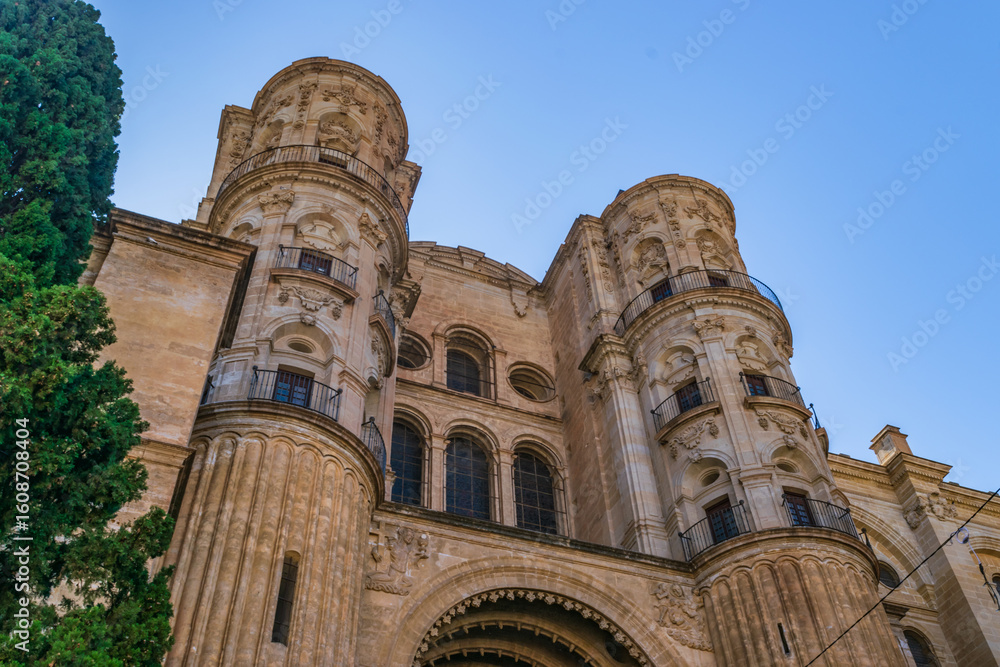 Fototapeta premium The grand Renaissance-Baroque façade of the Málaga Cathedral, a prominent architectural landmark located in the historic center of the city. 