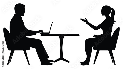 Silhouettes of a man and woman sitting at a table with a laptop engaged in conversation or a meeting symbolizing business collaboration and communication