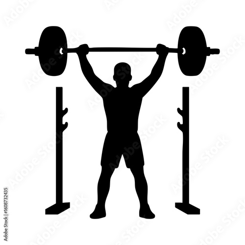 Silhouette of weightlifter raising heavy barbell