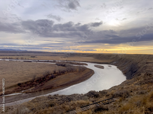 Missouri river on overcast day at sunset looking at a bend in the river 
