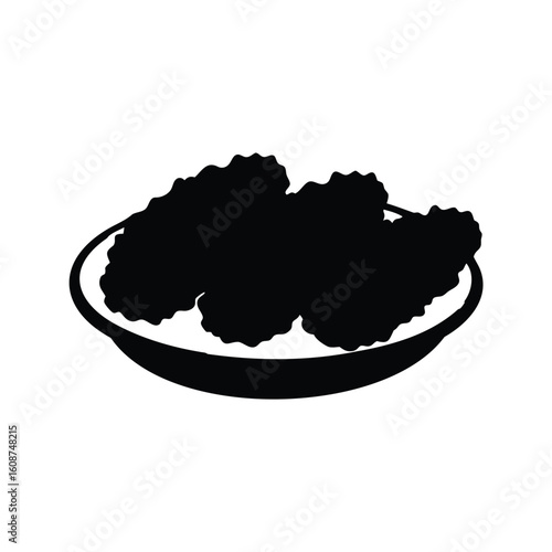 Silhouette of Fried Chicken Nuggets on a Plate Ready to be Served