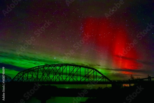 bridge and the red flash aurora borealis at night northern lights missouri river truss bridge 