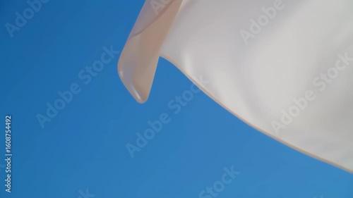 Light fabric against a clear blue sky
