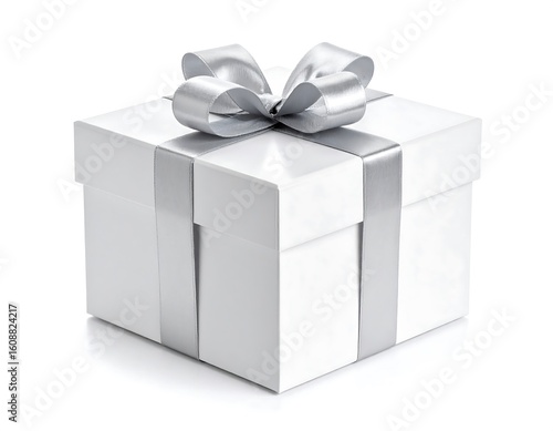 Elegant white gift box tied with a shiny silver ribbon and bow, studio shot