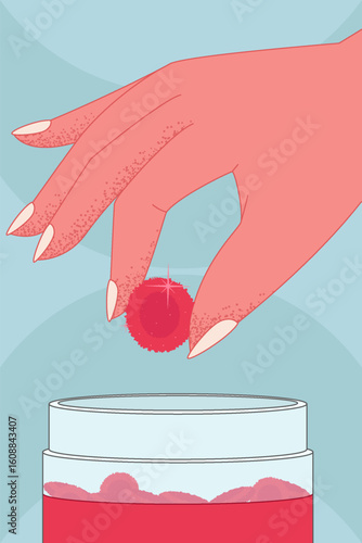 A hand picking a red gummy from a jar of soft chewable vitamins.