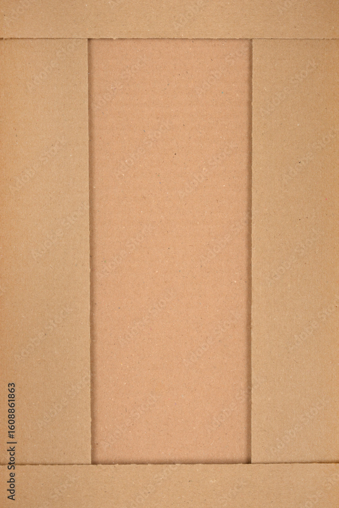 Fototapeta premium A top-down view shows the interior of a cardboard box with visible creases and a central rectangular opening