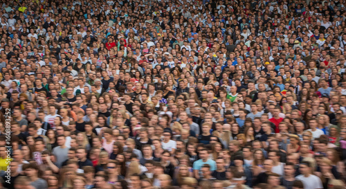 Large crowd of people in a stadium.