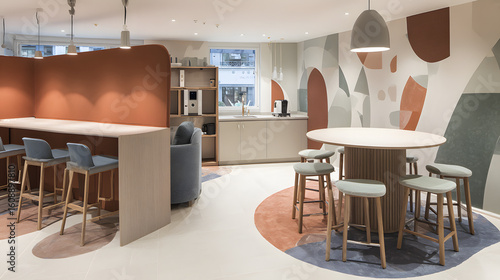 Minimalist coworking space with abstract art and clean modern design, bathed in soft ambient light.