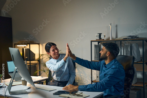 Photos Two Professionals Celebrating Success In A Modern Office By Sharing A High Five,