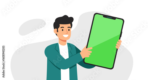 Man presenting a large smartphone with a green screen, ideal for app demos or website mockups.