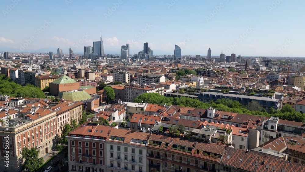 Fototapeta premium Europe, Italy, Milan 07,26,2025 Drone view of Sforza Castle tourist attraction in downtown with fountain, Sempione park and the new skyline with skyscrapers of Gae Aulenti and Citylife district