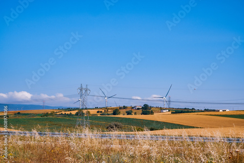 view of of fields and wind energy turbines