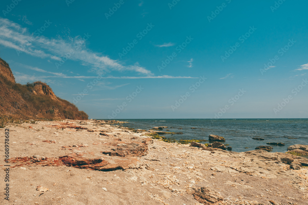Wild beach with high shore and rocks. Wild beach in Romania, Vama Veche. Wild beach with high shore and rocks. Wild beach in Romania, Vama Veche.
