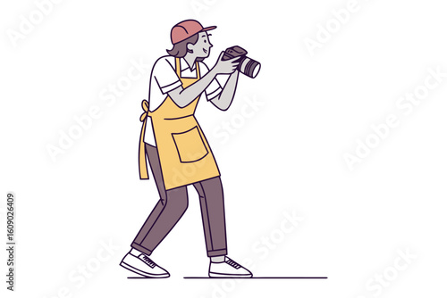 Artist wearing an apron and cap captures a moment with a professional camera focused on their subject