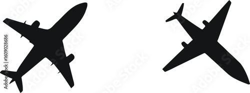 Airplane icon set, two black vector jets in opposing diagonal orientations with wings and tail fins