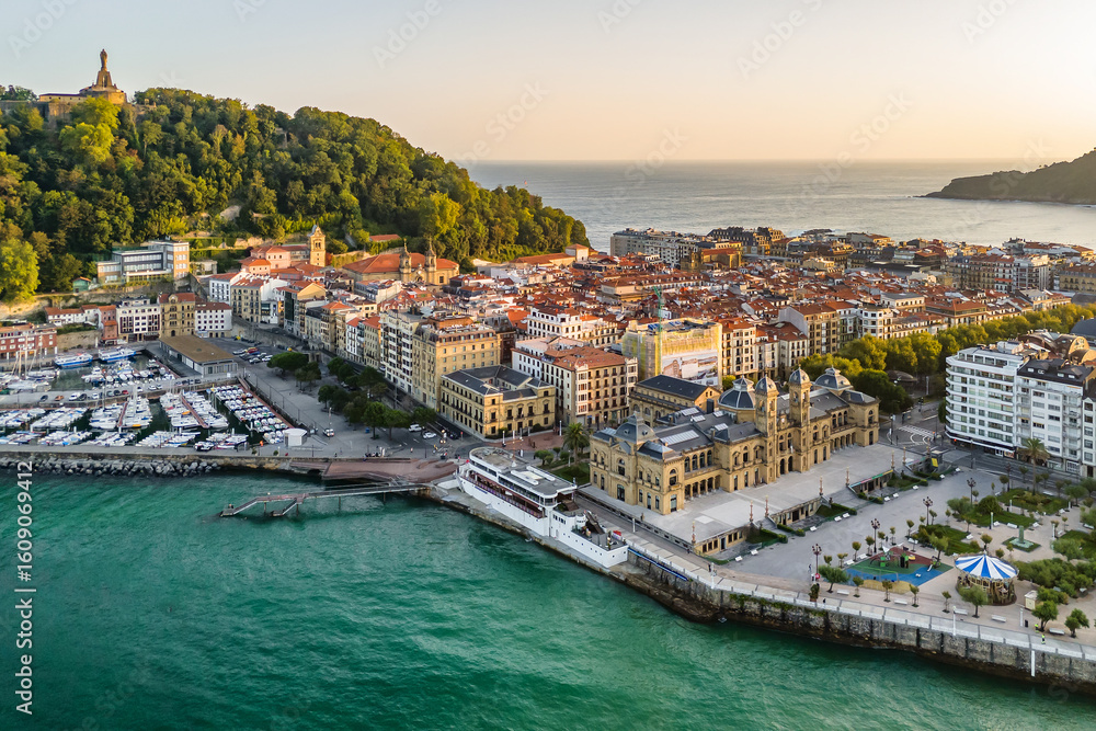 Fototapeta premium Aerial view of San Sebastian cityscape at sunrise in the Basque Country, northern Spain.