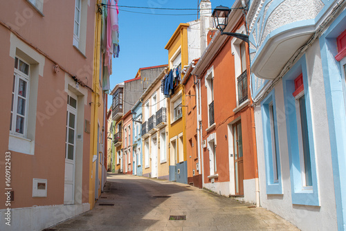 Fototapeta Colorful architecture in the main street of Cariño, a small town of Galicia, Spain
