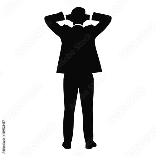 Silhouette of a businessman with hands behind his head