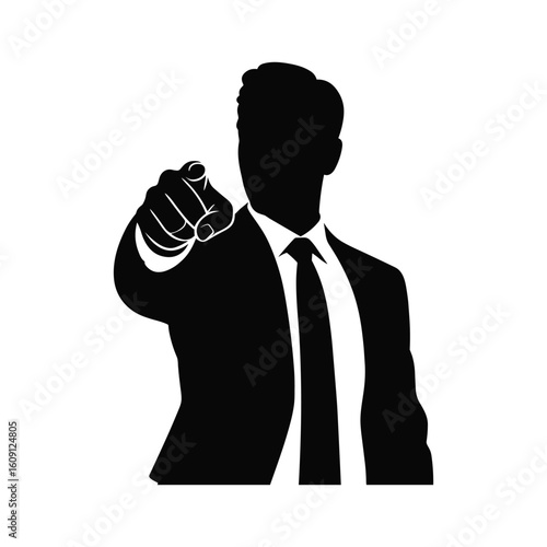 Silhouette of a businessman pointing forward with determination