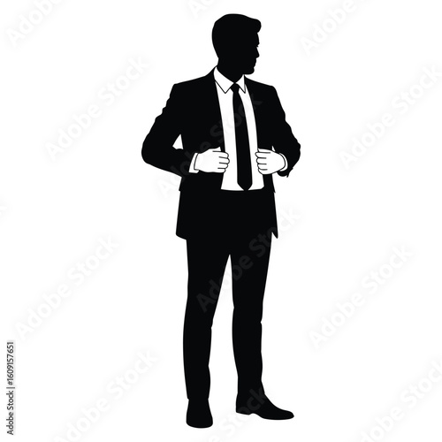 Silhouette of a businessman in a suit adjusting his tie