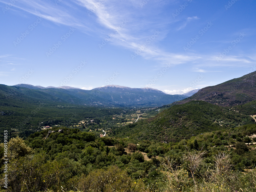 Panoramic inland view of Kefalonia Island in Greece with Mediterranean vegetation and mountainous terrain. The scenic landscape features gentle hills and rugged peaks bathed in natural sunlight. Panoramic inland view of Kefalonia Island in Greece with Mediterranean vegetation and mountainous terrain. The scenic landscape features gentle hills and rugged peaks bathed in natural sunlight.