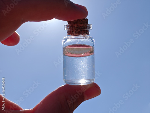 hand holding a bottle of water