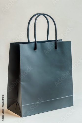 Stylish Black Shopping Bag on a Light Background for Retail Display and Promo...