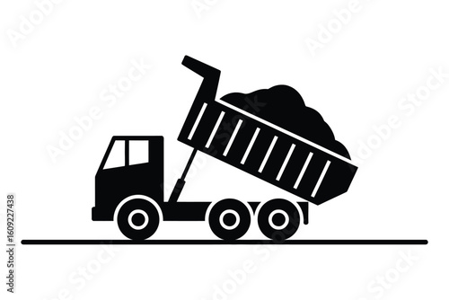 Black silhouette of a dump truck unloading material