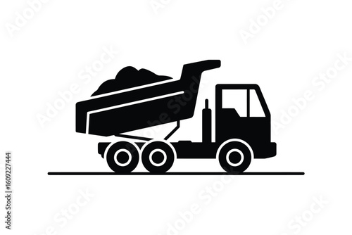 Black silhouette of a dump truck loaded with dirt