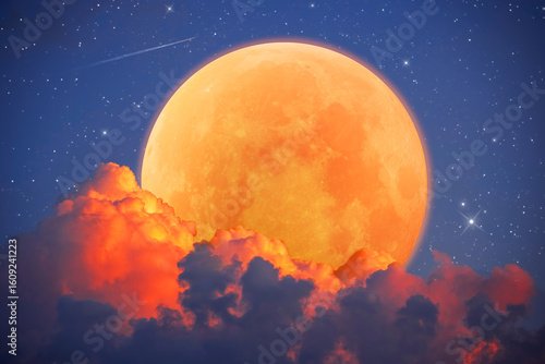Fantastic astrological background with an orange moon emerging from red clouds, a beautiful full moon with stars and sky