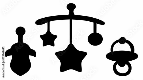 Silhouette of baby mobile with stars and ball shapes alongside a rattle and a pacifier design icon | editable eps vectors