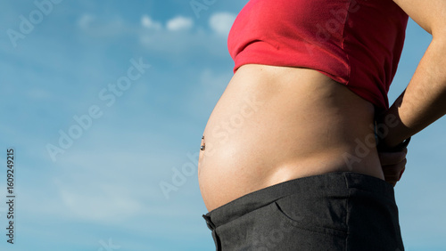 Tableau sur toile Pregnant woman outdoors touching belly in nature