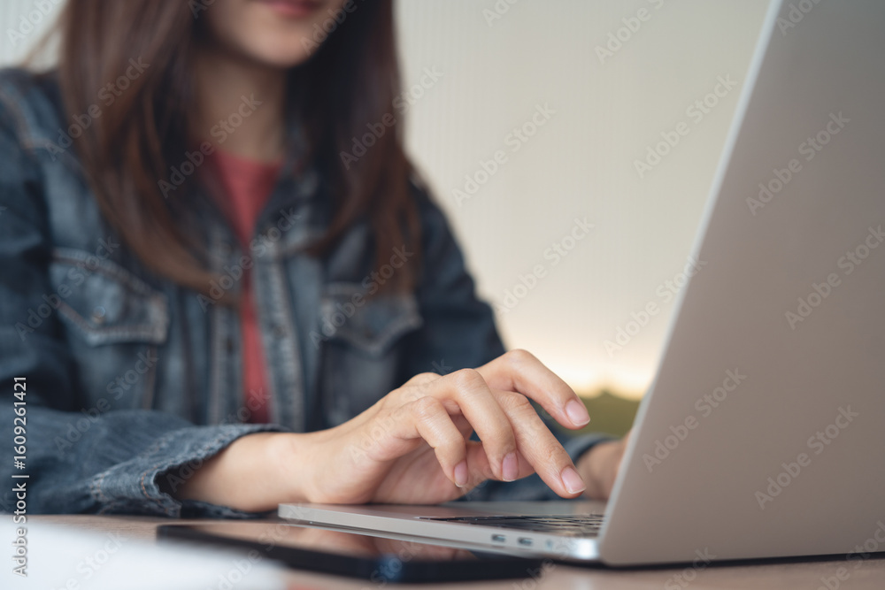 Business woman working remotely, using laptop computer, surfing the internet at coffee shop. online job, freelance at work, business casual. Student studying online class via laptop Business woman working remotely, using laptop computer, surfing the internet at coffee shop. online job, freelance at work, business casual. Student studying online class via laptop