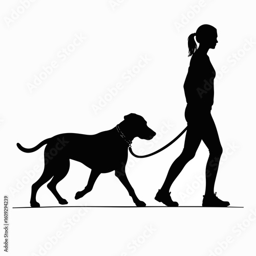 Woman walking dog downtown in silhouette against white background. Woman walking dog downtown as she strolls with pet.