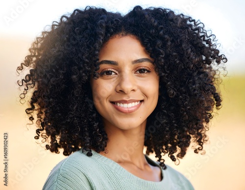 Portrait of a beautiful smiling African American woman with curly hair