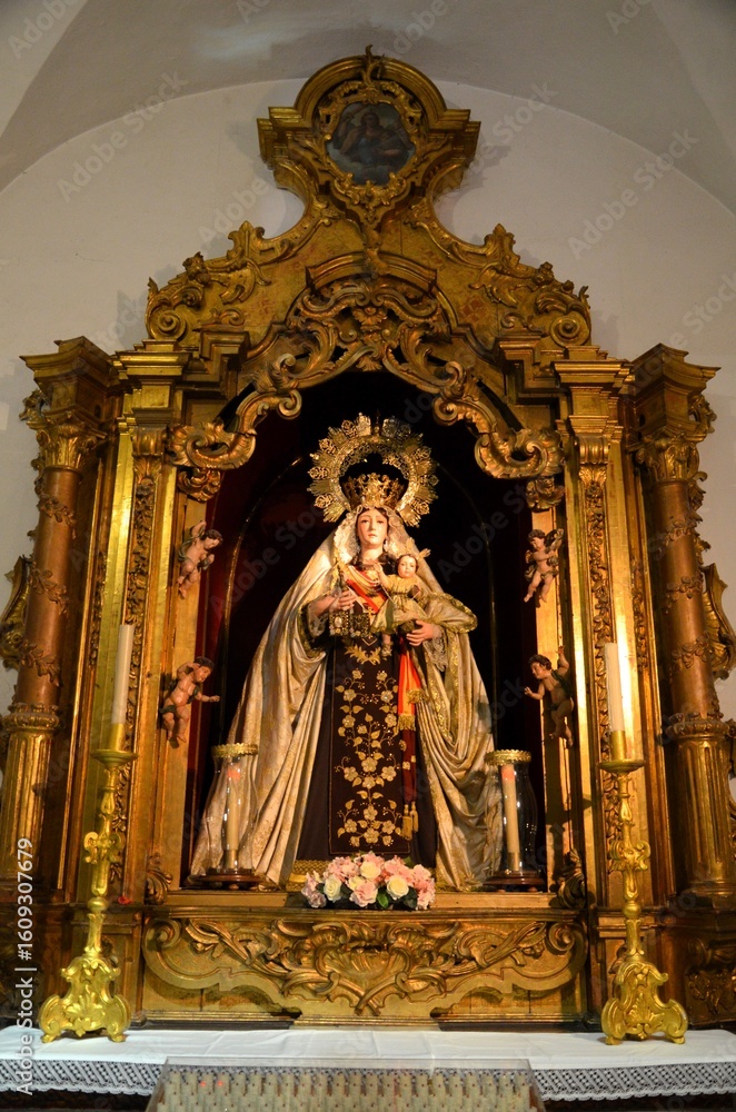 Obraz premium Cadiz, Spain 03.26.2019: The altarpiece of the Virgin of Carmen, in the Church of Santiago