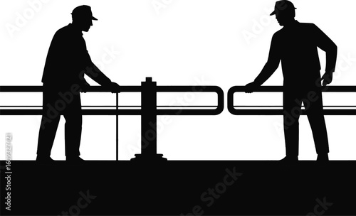 Two men operating flood gate barrier silhouette black