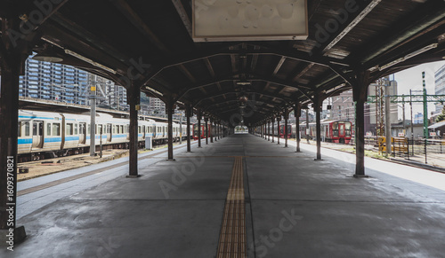 Historic Mojiko Station Platform with Traditional Wooden Architecture and Train in Fukuoka, Japan