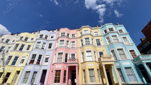 Colorful houses and vibrant architecture in the Notting Hill district of London. Concept of iconic cityscapes, charming streets, and travel in one of the most picturesque London neighborhoods