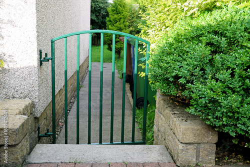 Small Gate Leading to an Urban House Garden Path