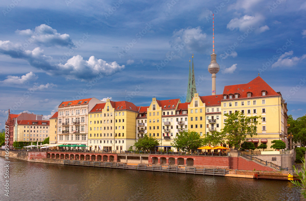 Naklejka premium View of Nikolaiviertel district with the Berlin TV Tower and historic buildings along the Spree River in Berlin Germany
