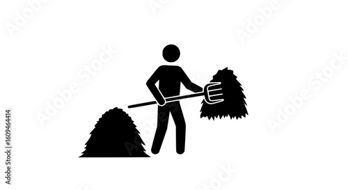 A man collecting hay